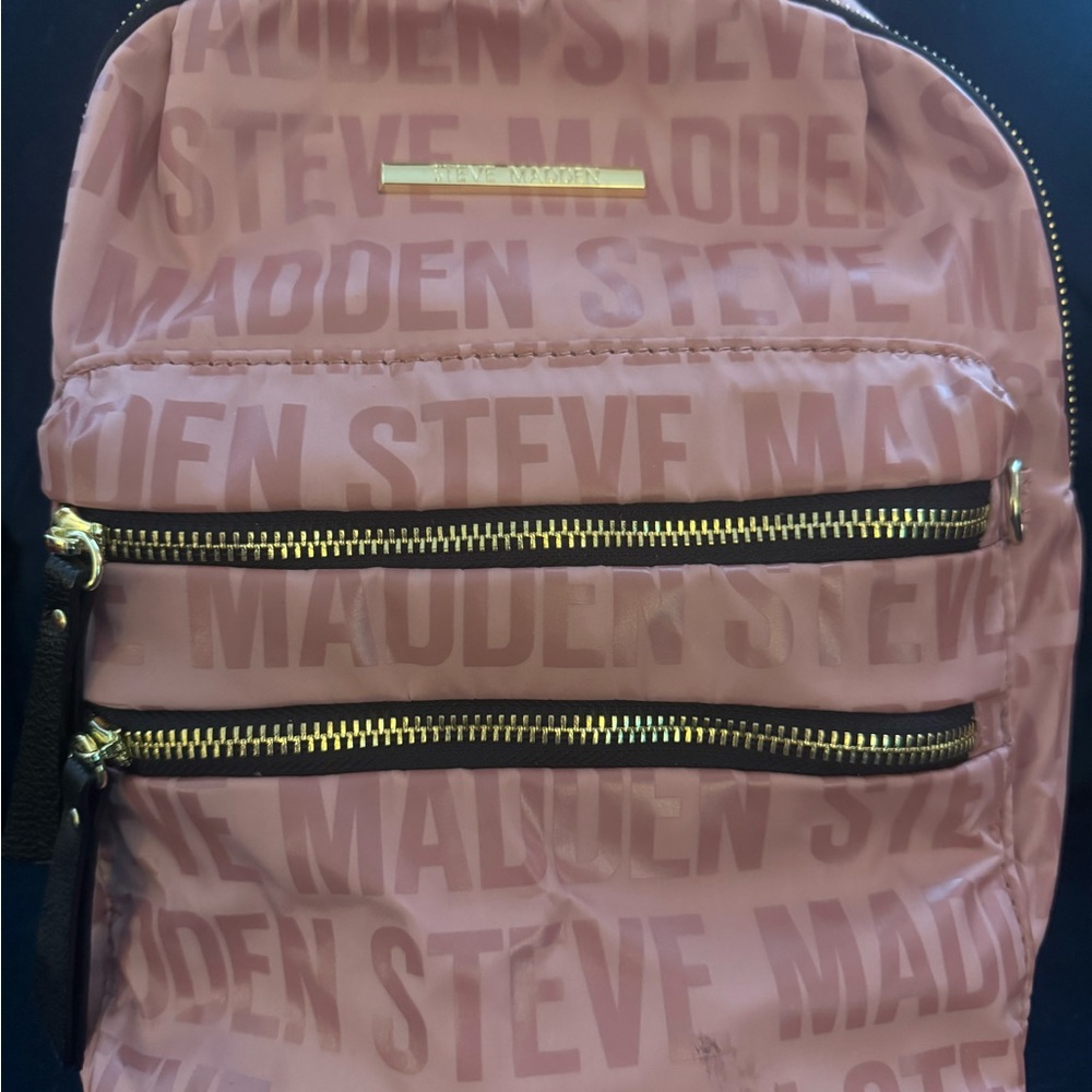 Pink Steve Madden backpack. Very roomy. Used a few times. Soft material.